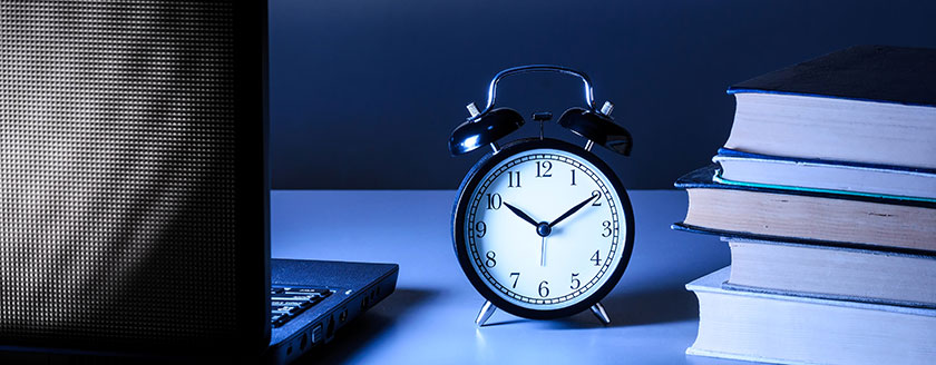 Clock On Desk Books Laptop Night