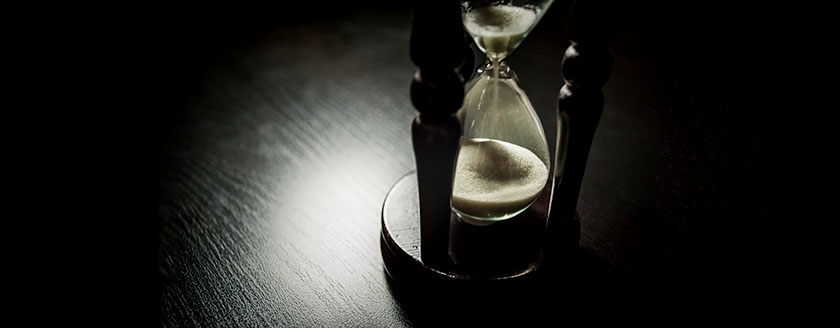 Hourglass On Dark Wood