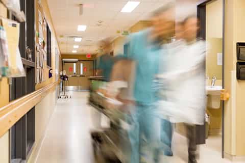 Rushing Gurney Down Hospital Hallway Emergency De[t